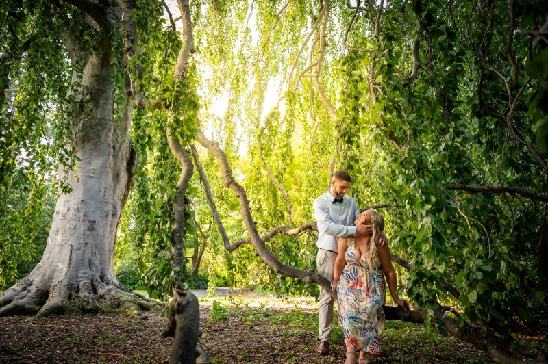 Wayne and Christy together in a wide garden scene
