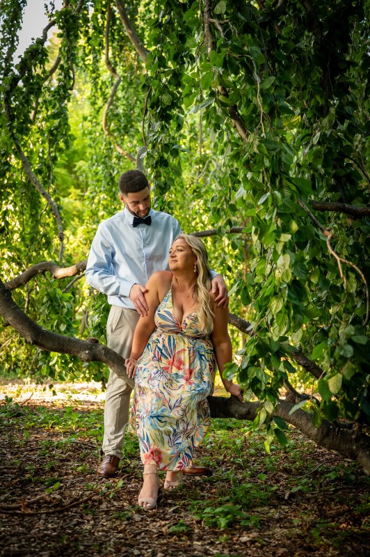 Wayne and Christy beneath green branches