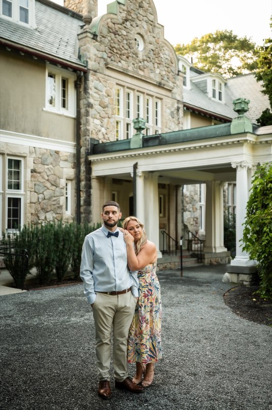 Wayne and Christy beside a stone building