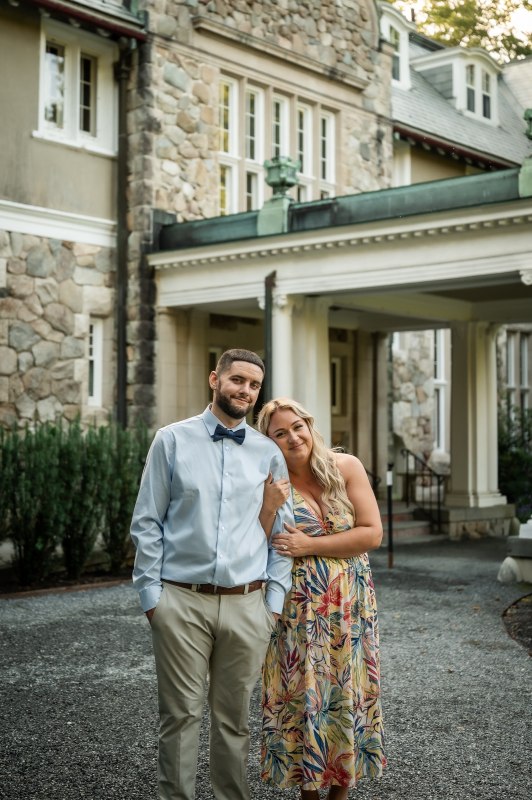 Wayne and Christy in front of a stone building