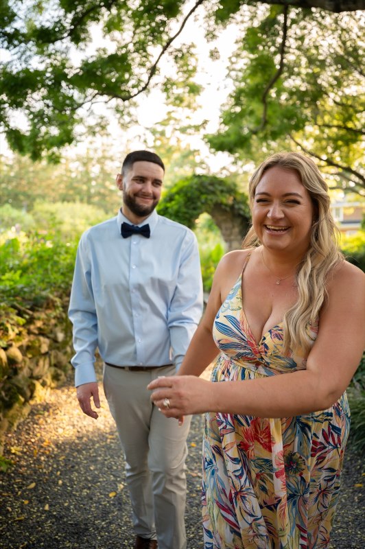 Christy holding Wayne’s hand in the garden
