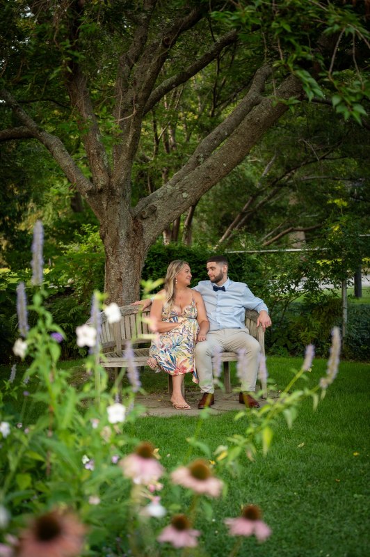 Wayne and Christy seated on a garden bench