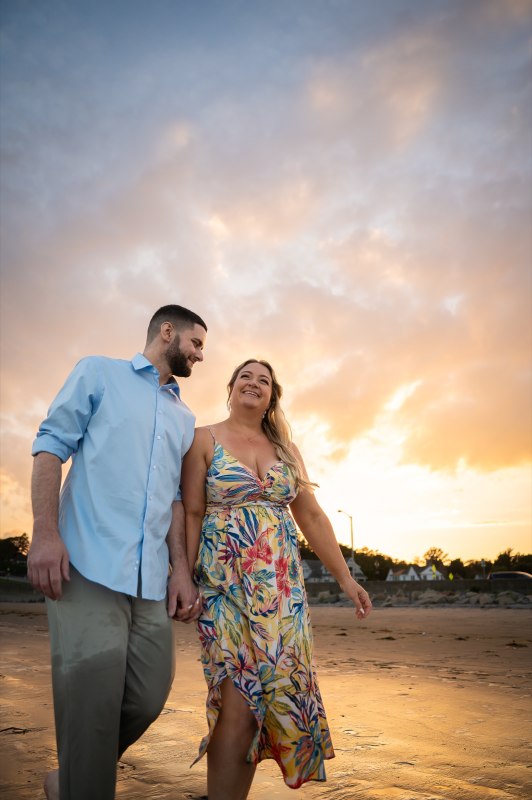 Wayne and Christy walking together at sunset