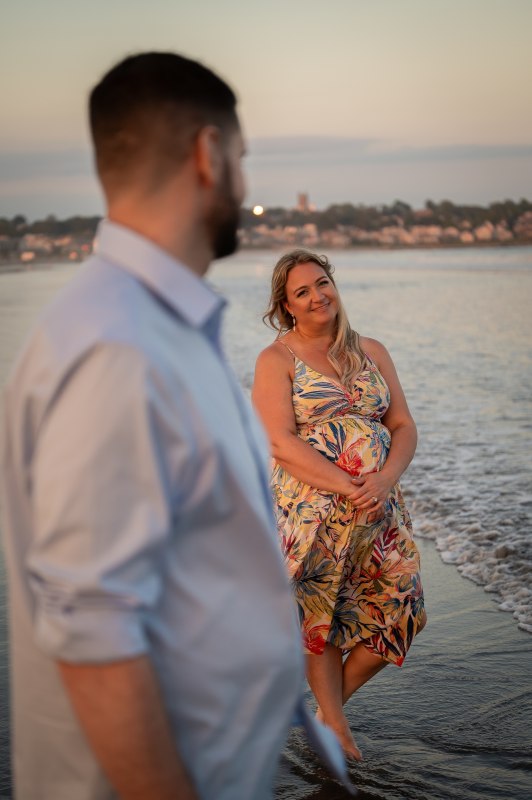 Wayne in the foreground with Christy on the beach